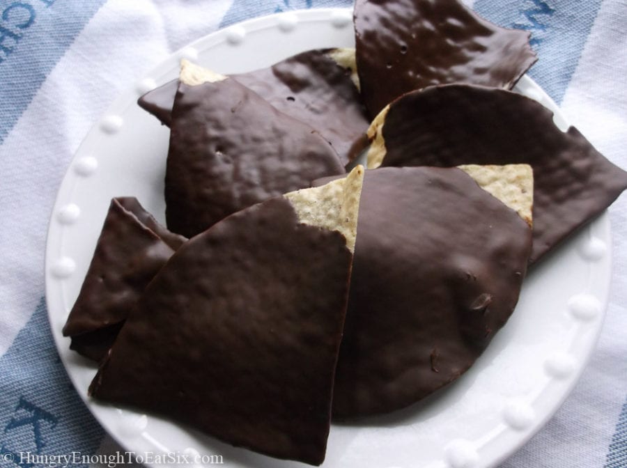 Tortilla chips coated in chocolate on a plate.