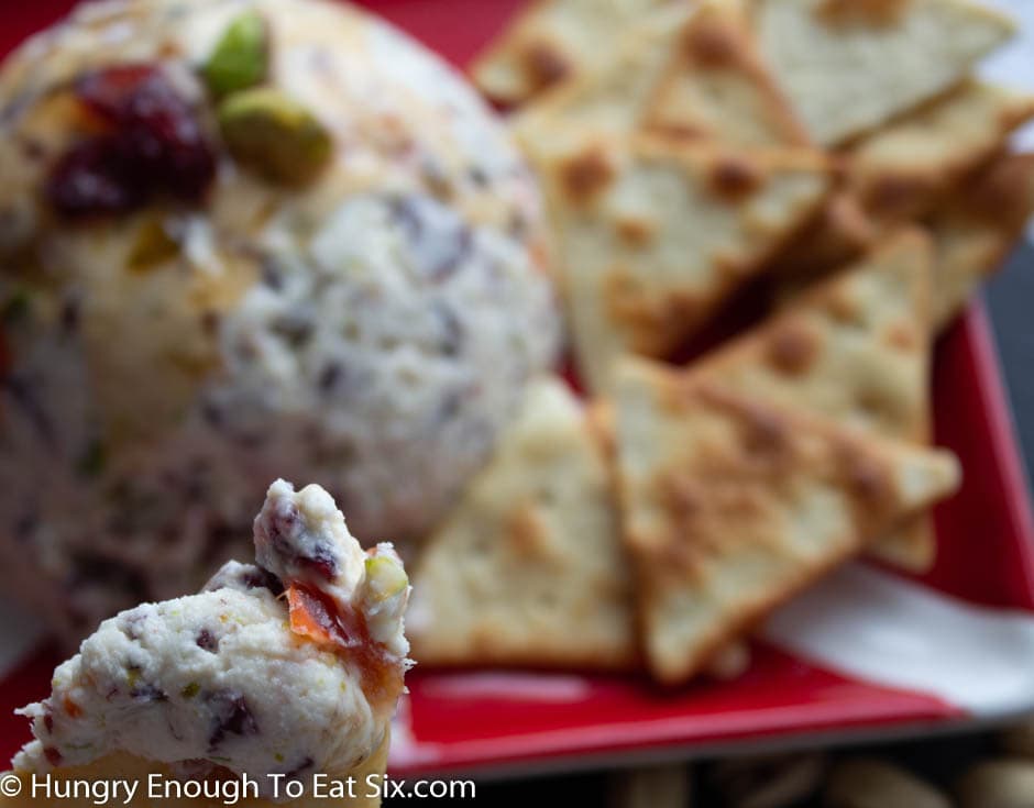 Goat cheese ball with cranberries and crackers.