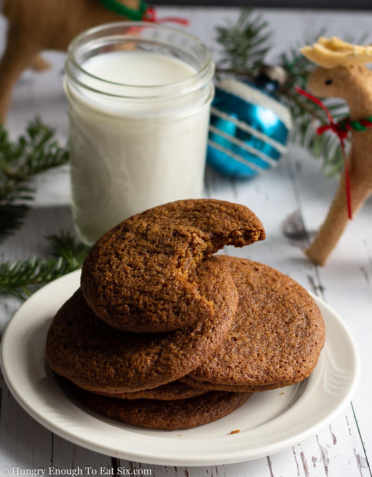 Molasses cookies next to a glass of milk