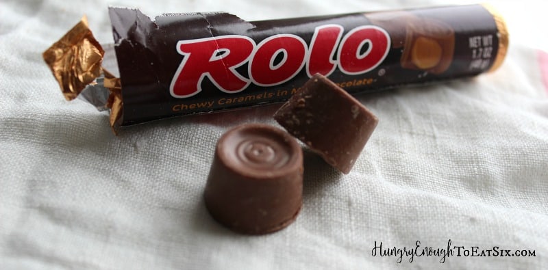 Rolo package and candies on a cloth.