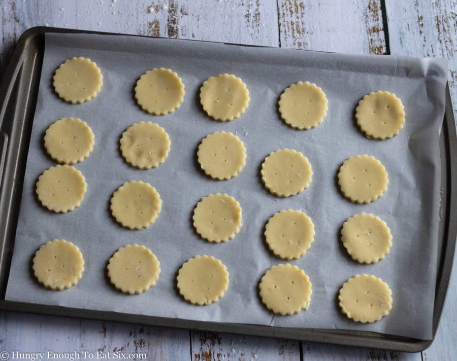 Round cookie cutouts on a baking sheet