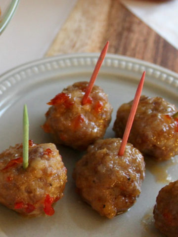 Red and green toothpicks in meatballs