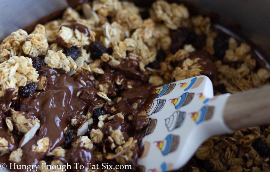 Stirring chocolate into granola
