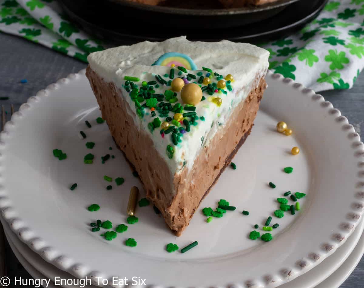 Chocolate pie with cream top and green sprinkles.