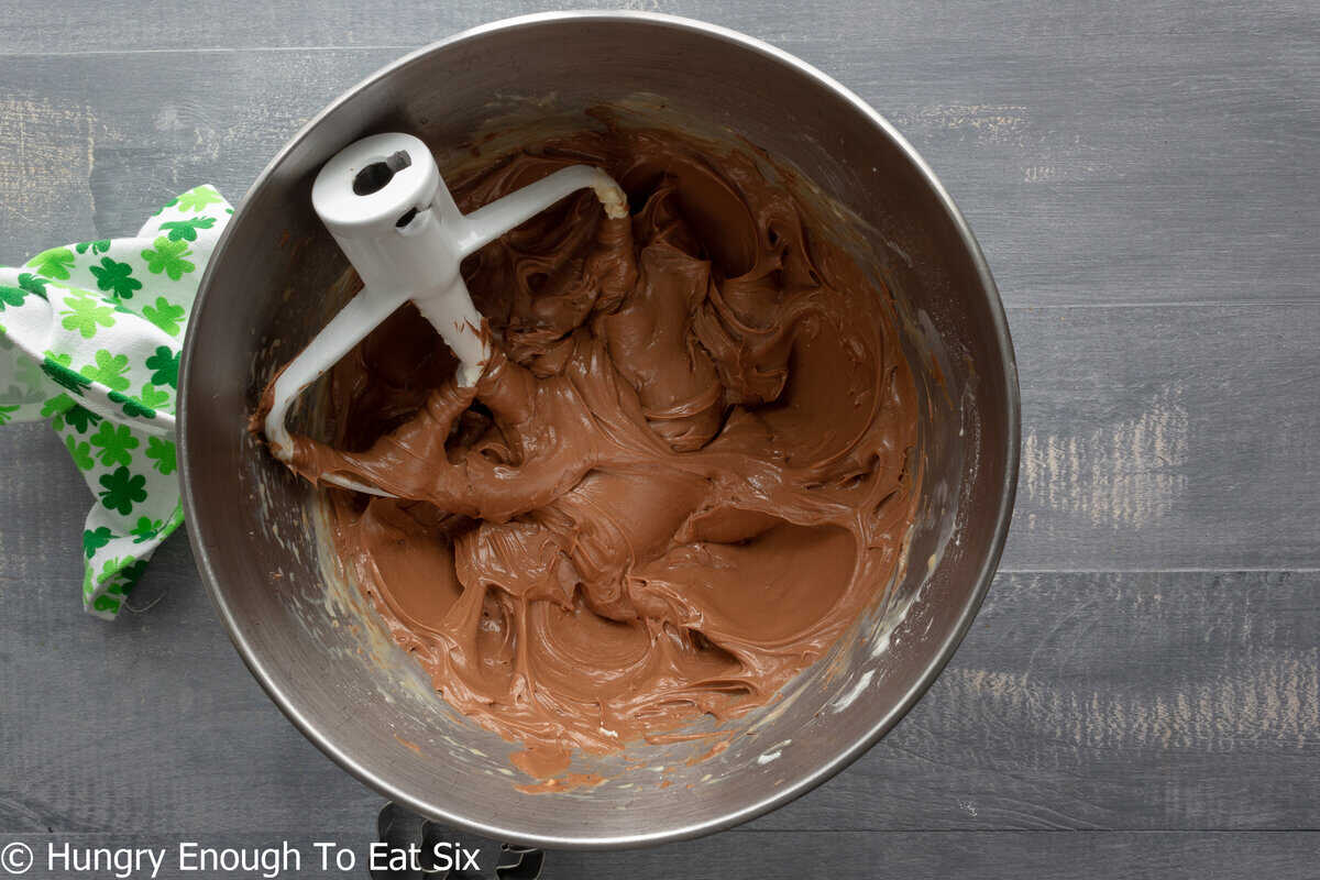 Mixing bowl and beater with chocolate cream cheese mixture.
