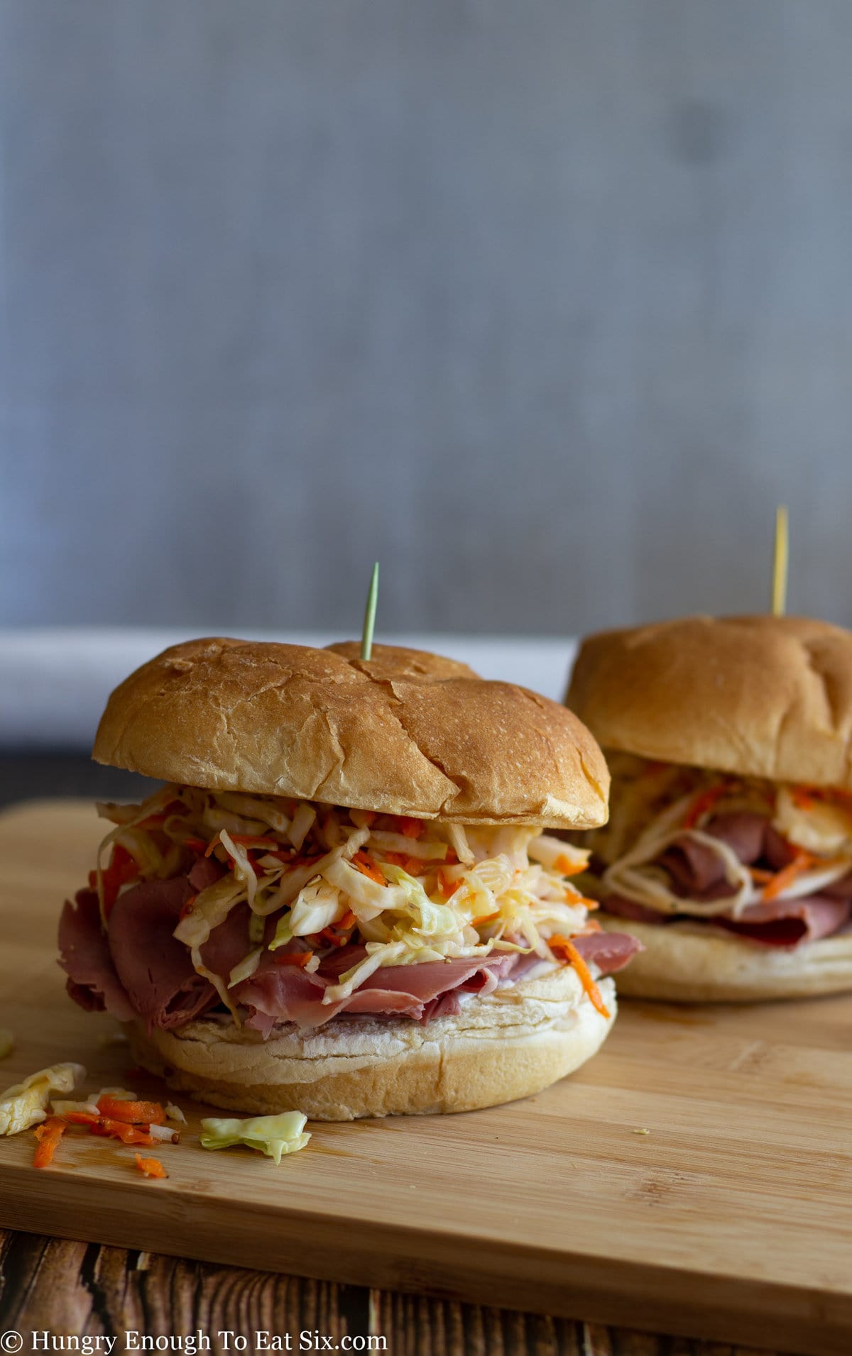Corned beef sandwiches with slaw on potato rolls.