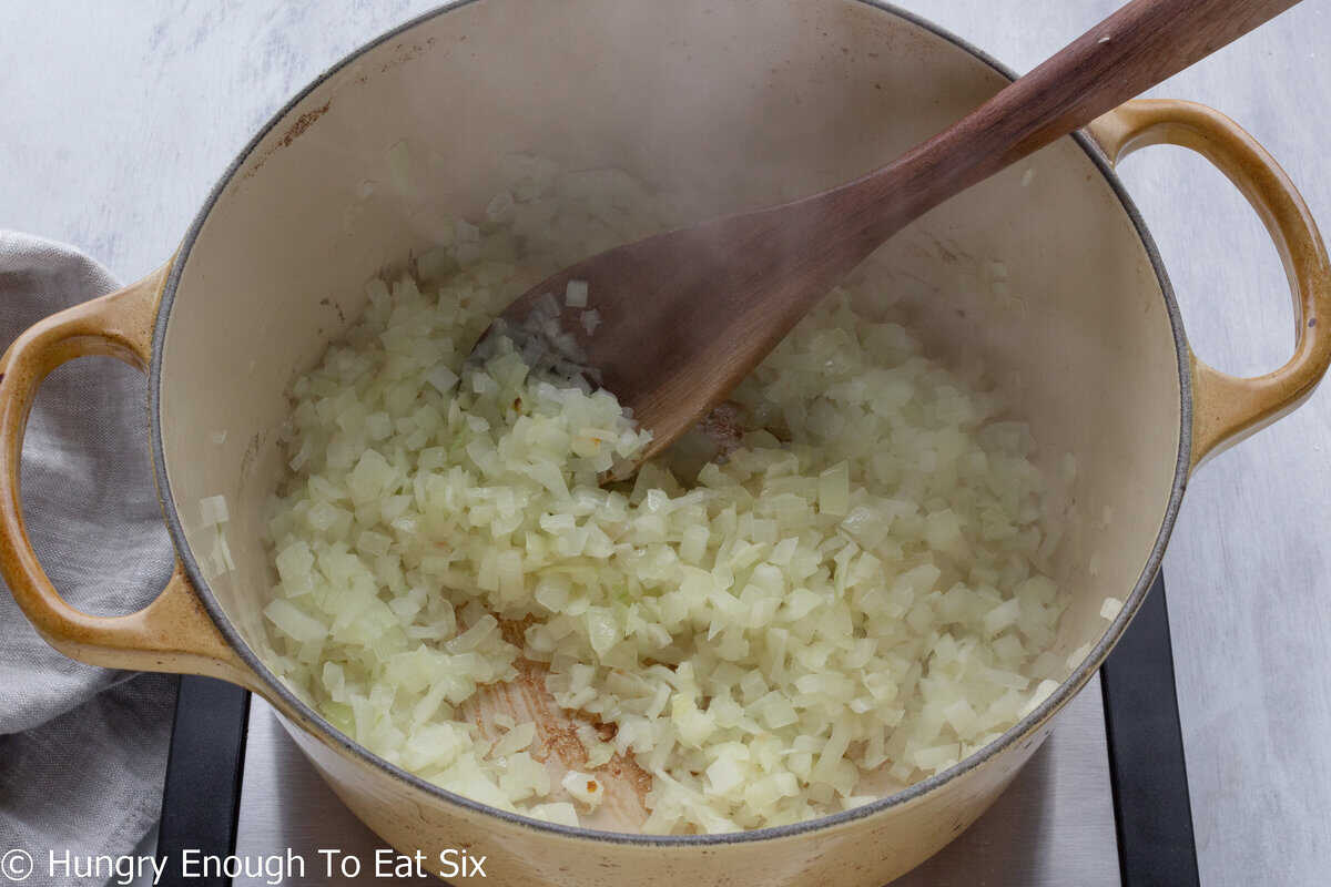 Diced onions sautéing in a pot.