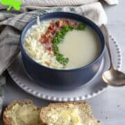 Bowl of potato soup with bacon, cheese and chives.