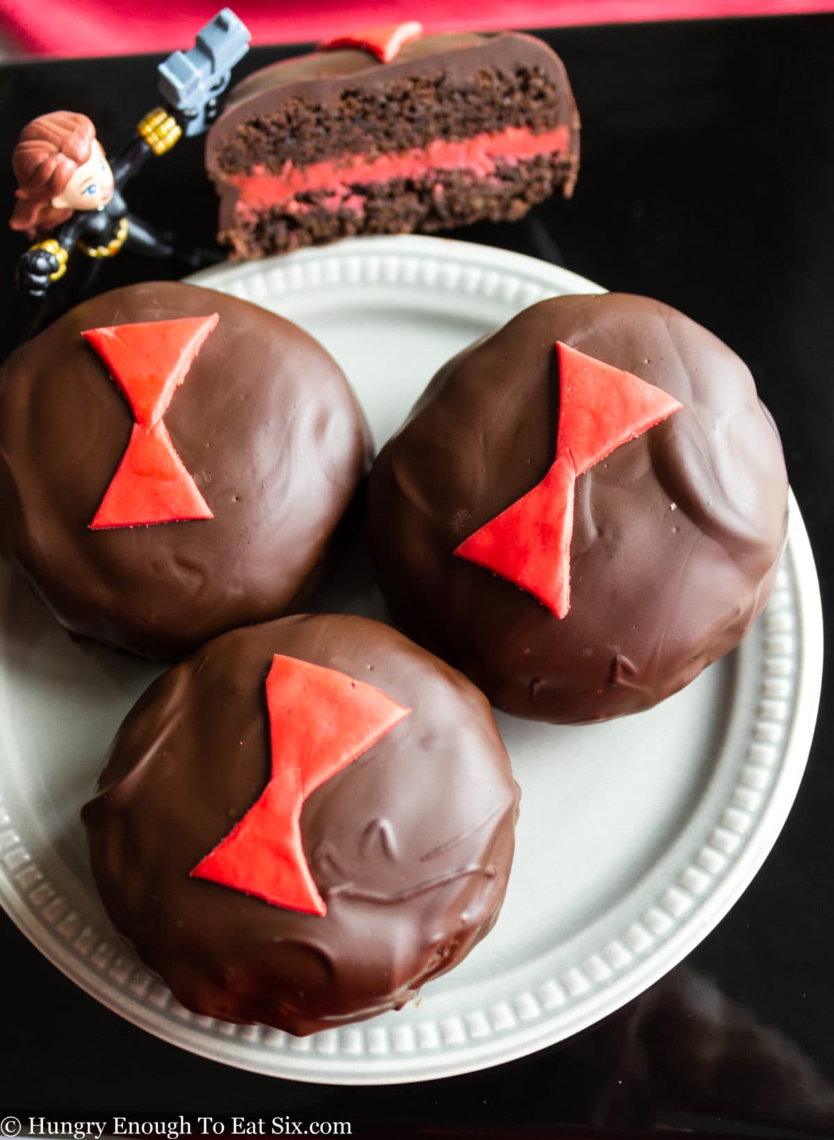 Plate of chocolate covered cookies with red emblems