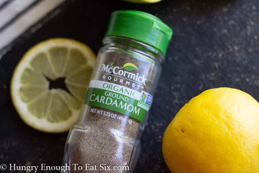 Lemons and a jar of cardamom spice