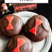 Plate of chocolate black widow cookies, Avengers-inspired treats.