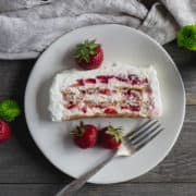 slice of strawberry cream cheese cake on plate.