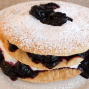 Cream and berries betweens rounds pastry layers
