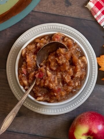 White bowl of homemade applesauce.