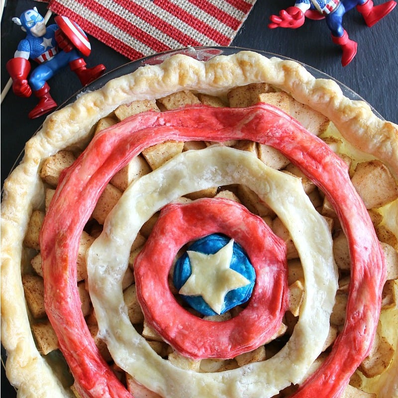 Apple pie topped with red and blue concentric rings of crust