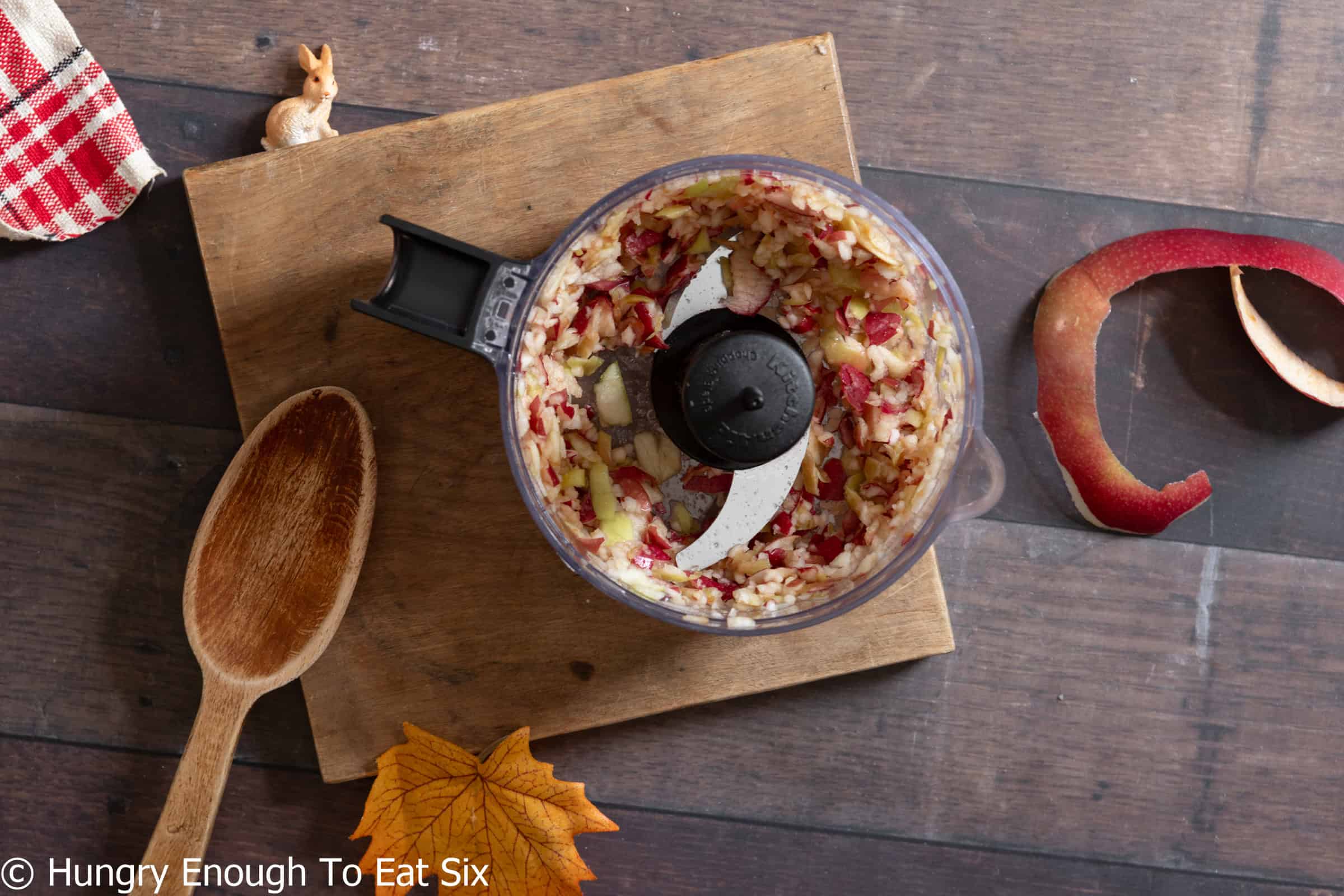 Food processor with apple bits, for homemade applesauce.