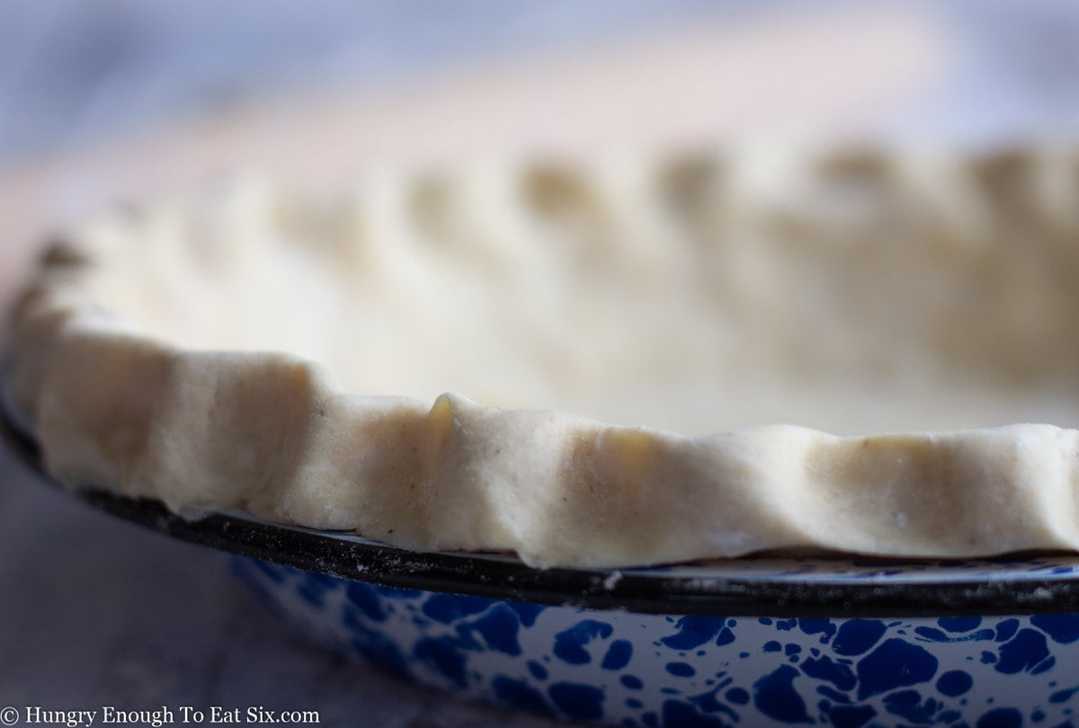Cloe up of crimped pie shell.