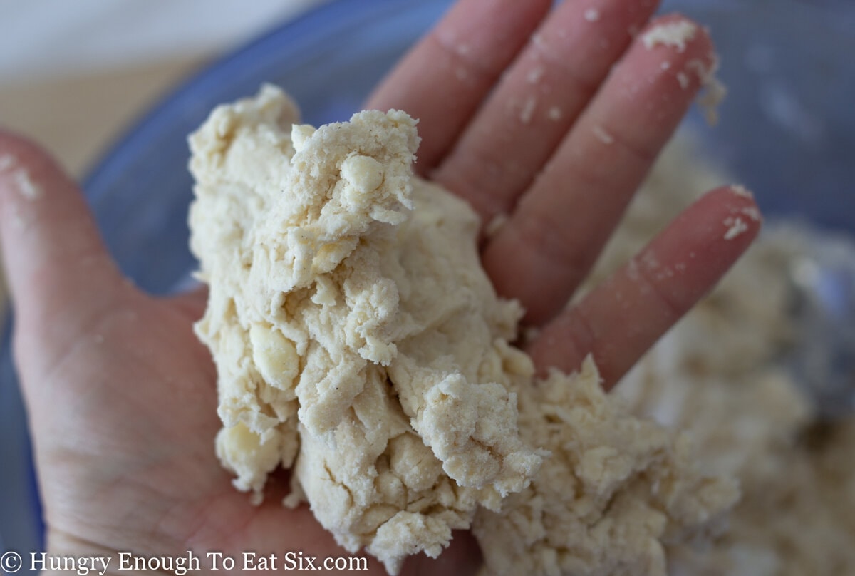Dough mixture squeezed together in palm of hand