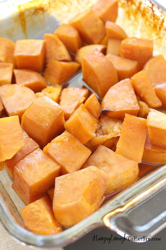 Cubes of roasted sweet potato in dish.