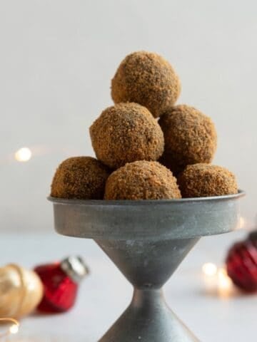 Gray metal dish with a pyramid of ginger cookie chocolate truffles.