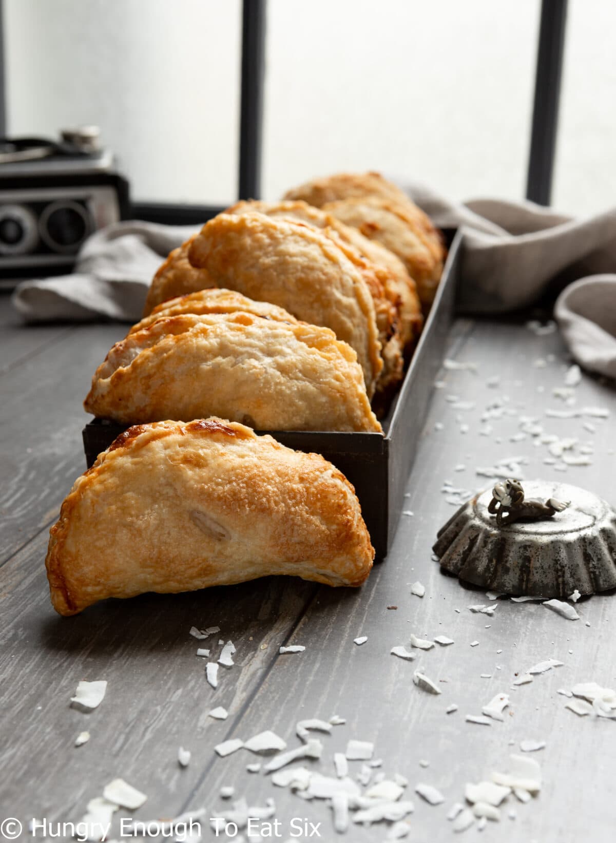 Row of half-moon shaped pastry pockets.