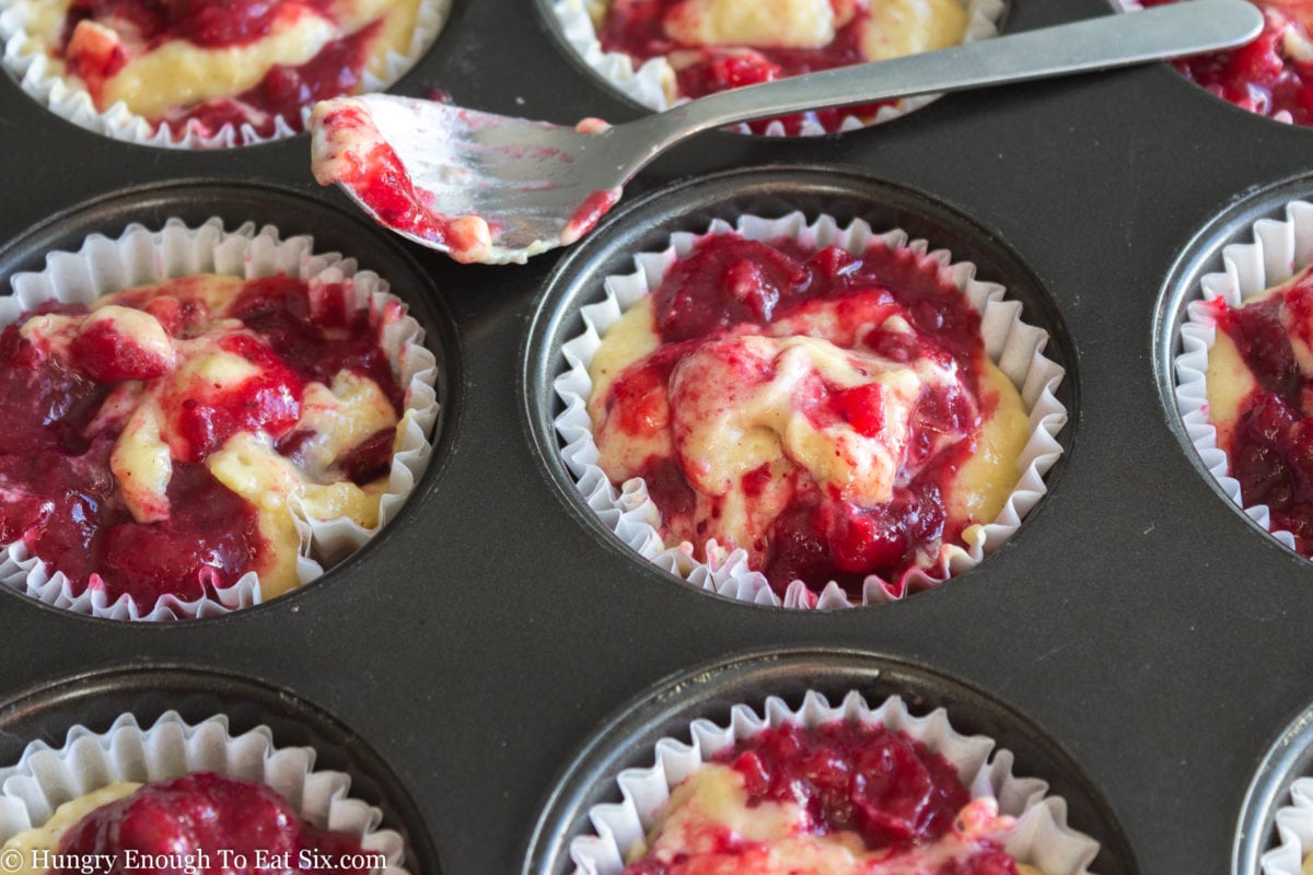 Berry swirled muffin batter in cupcake pan