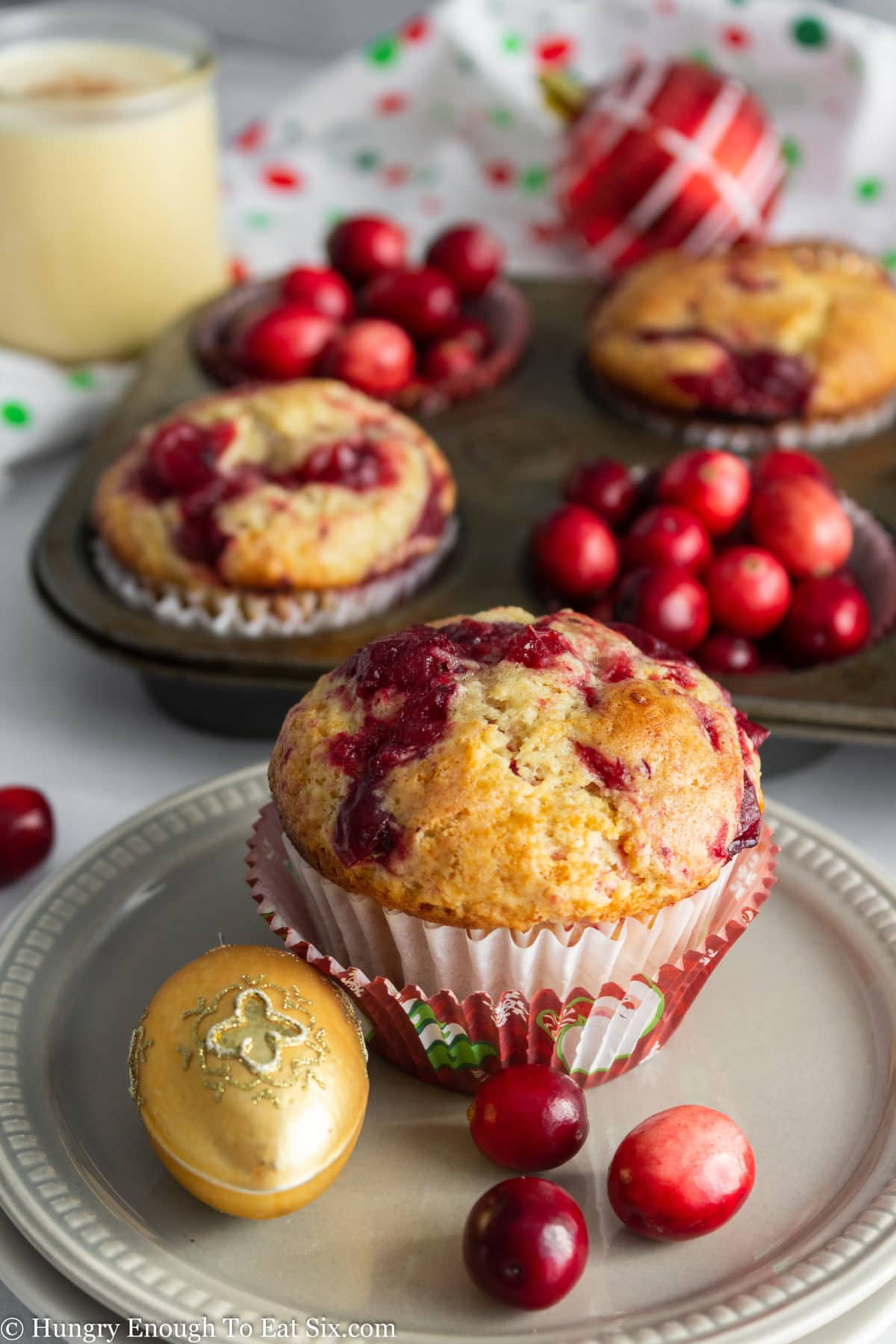 Muffins with whole cranberries in a plate