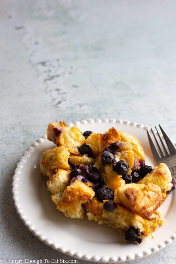 White plate with a serving of Blueberry French Toast Bake.