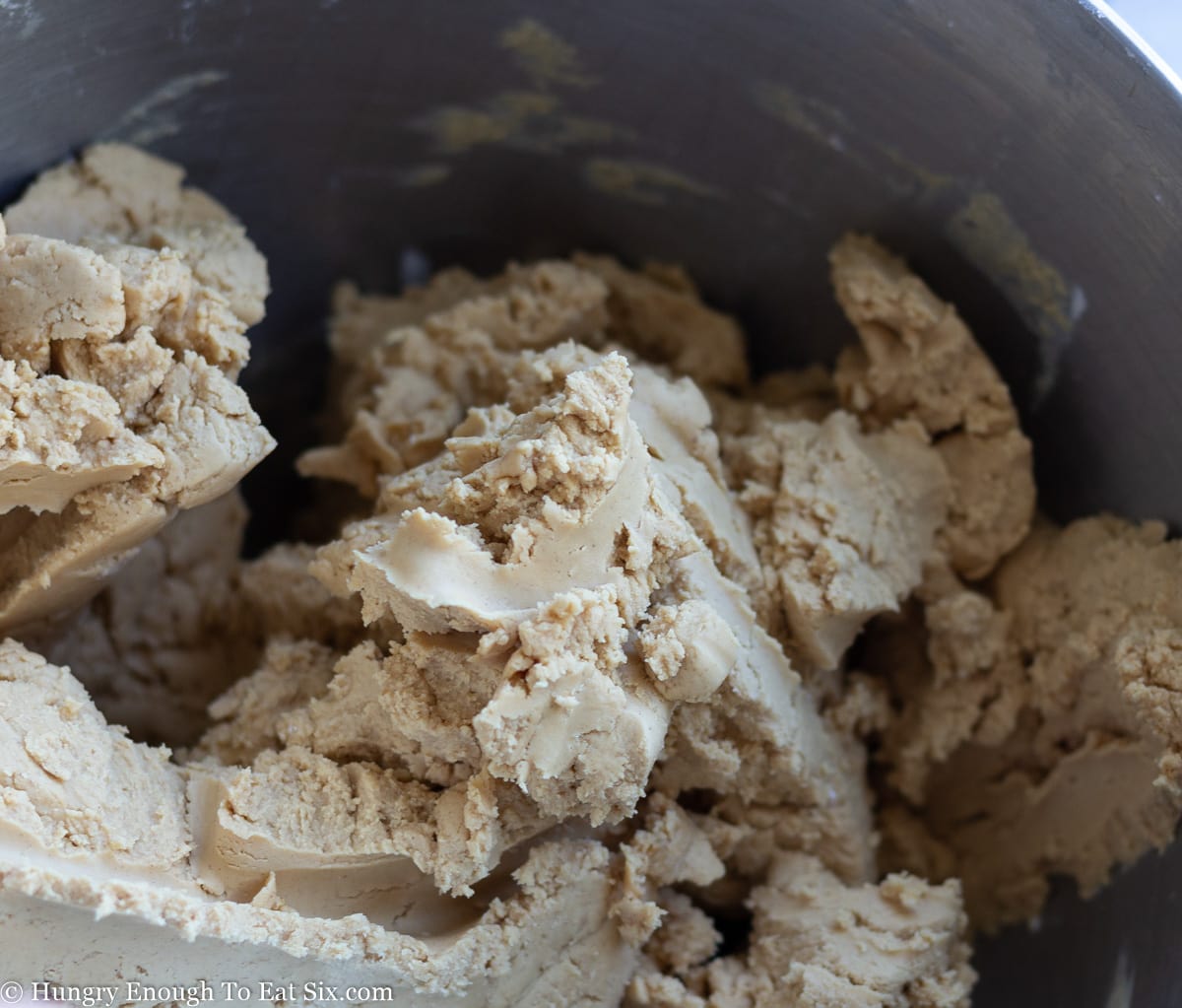 Peanut butter and sugar mixture in a mixing bowl
