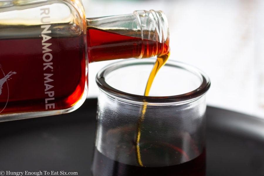 Runamok Syrup pouring into a glass.