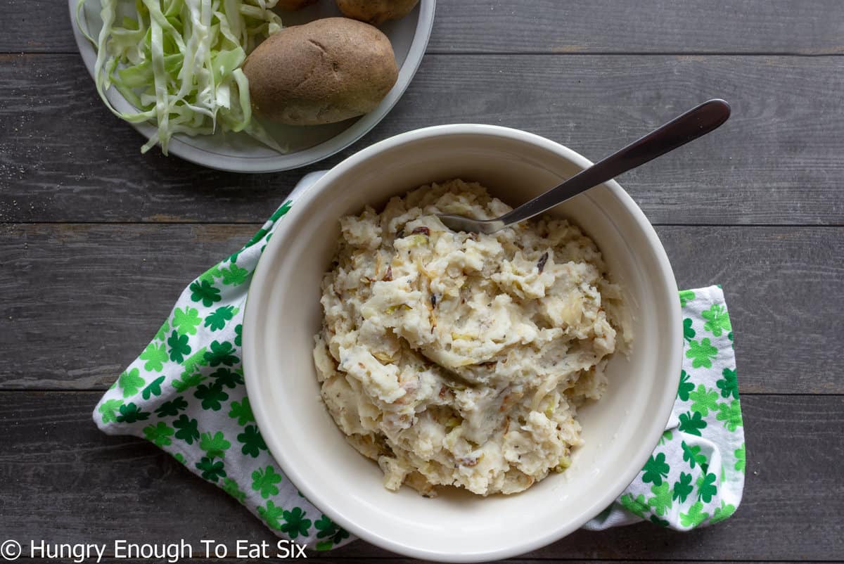 Colcannon mashed potatoes with cabbage in bowl.