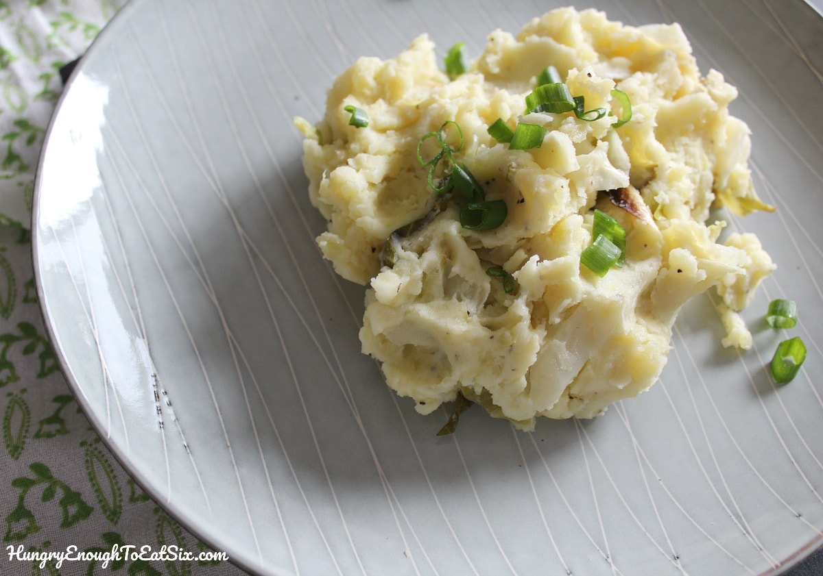Mashed potatoes with cabbage on a gray plate