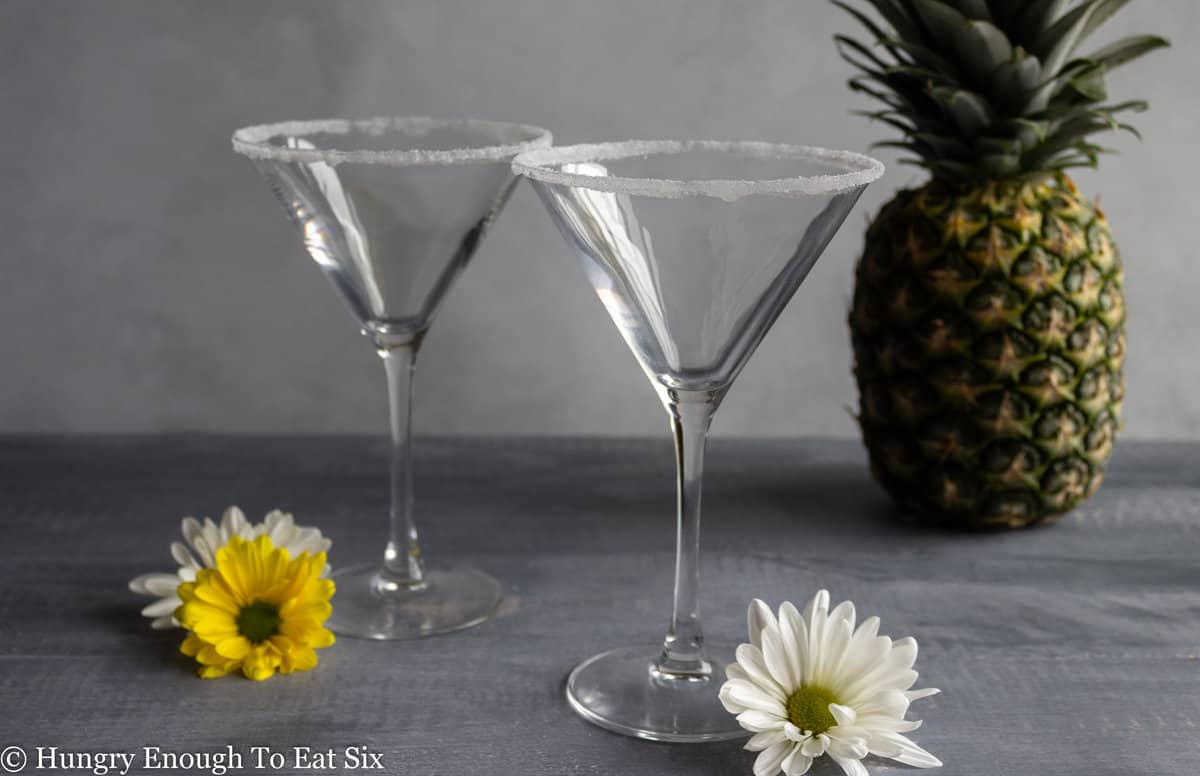 Two cocktail glasses with salted rims