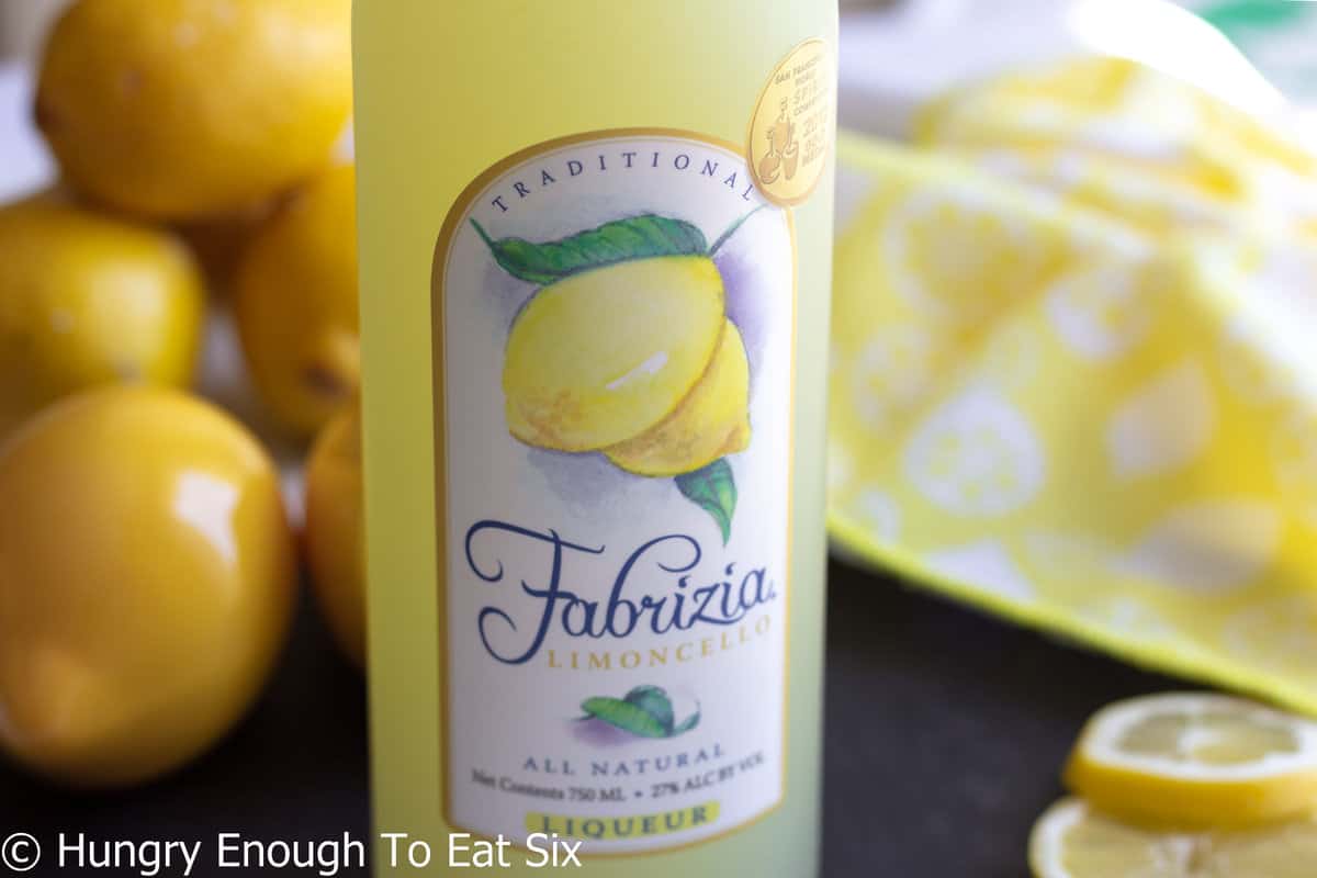 Bottle of limoncello with lemons on label.