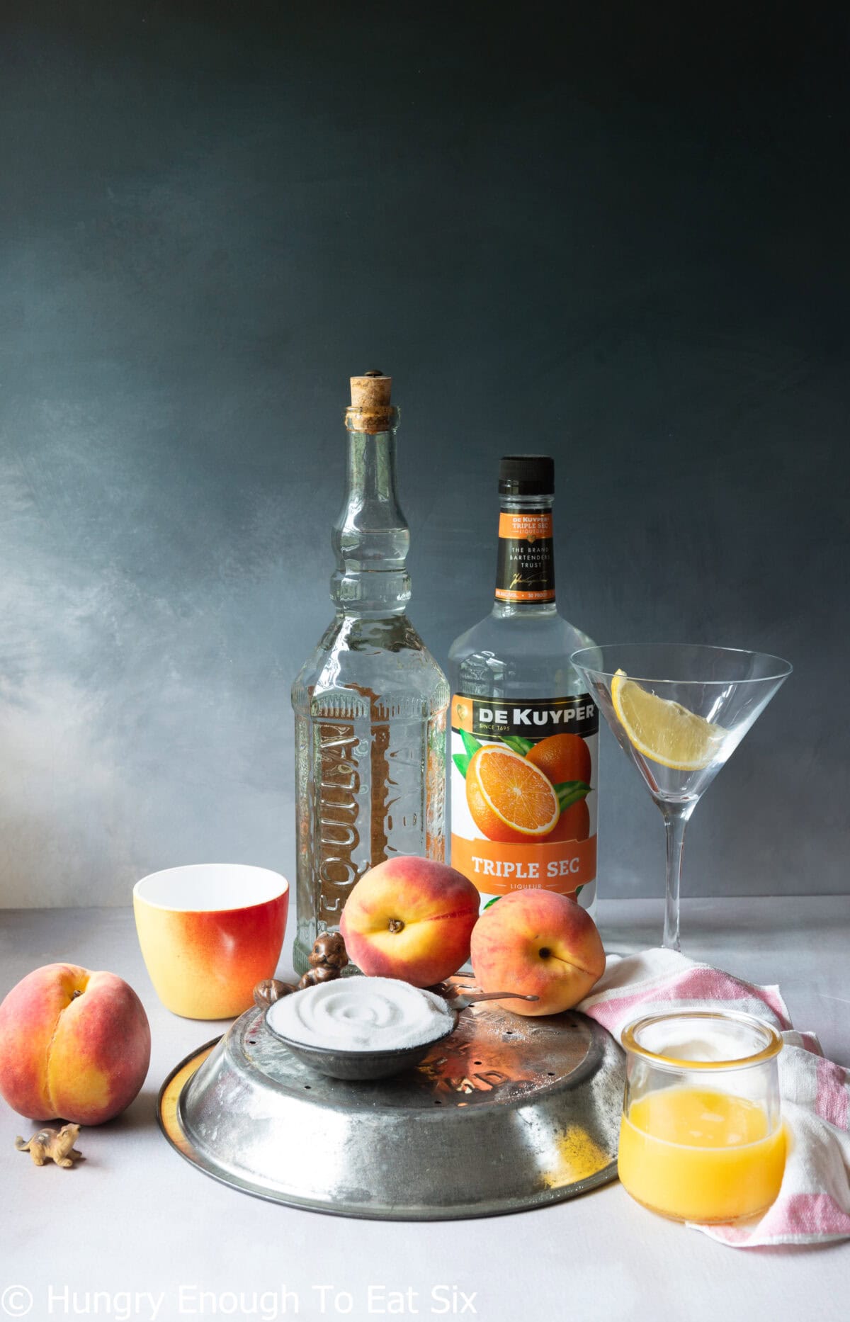 Tequila, peaches, orange juice, lemon slice, triple sec and sugar.