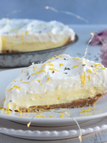 Creamy pudding pie slice on white plates.