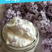 Text overlay on a photo of whipped cream and lilac flowers of light purple color.