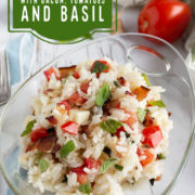 Bowl of rice with red tomato and basil