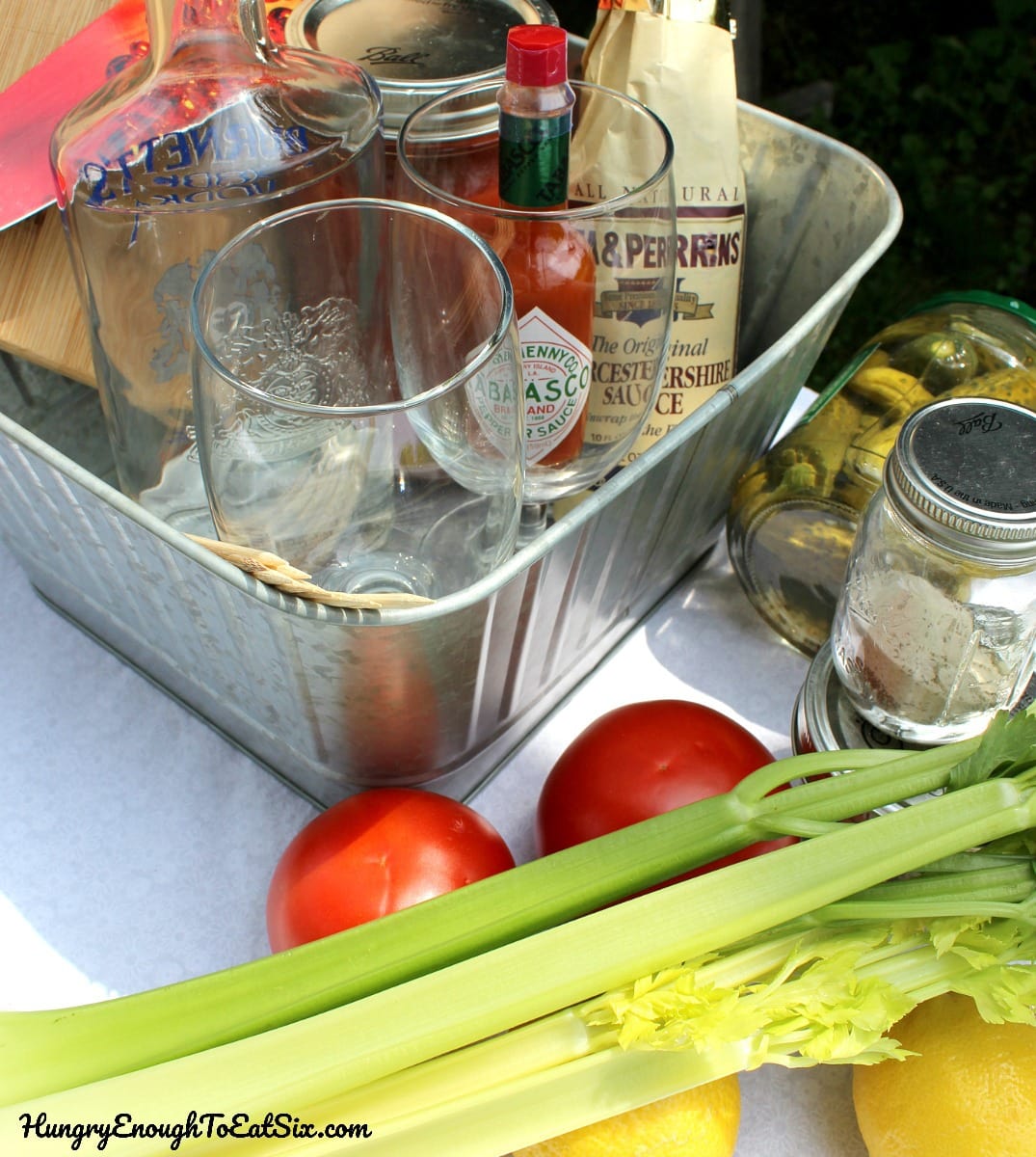 Celery, tomatoes, glasses, and seasonings