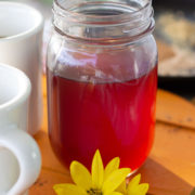 Clear brown syrup in a mason jar
