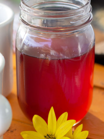 Clear brown syrup in a mason jar