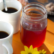 jar of brown syrup with coffee cups