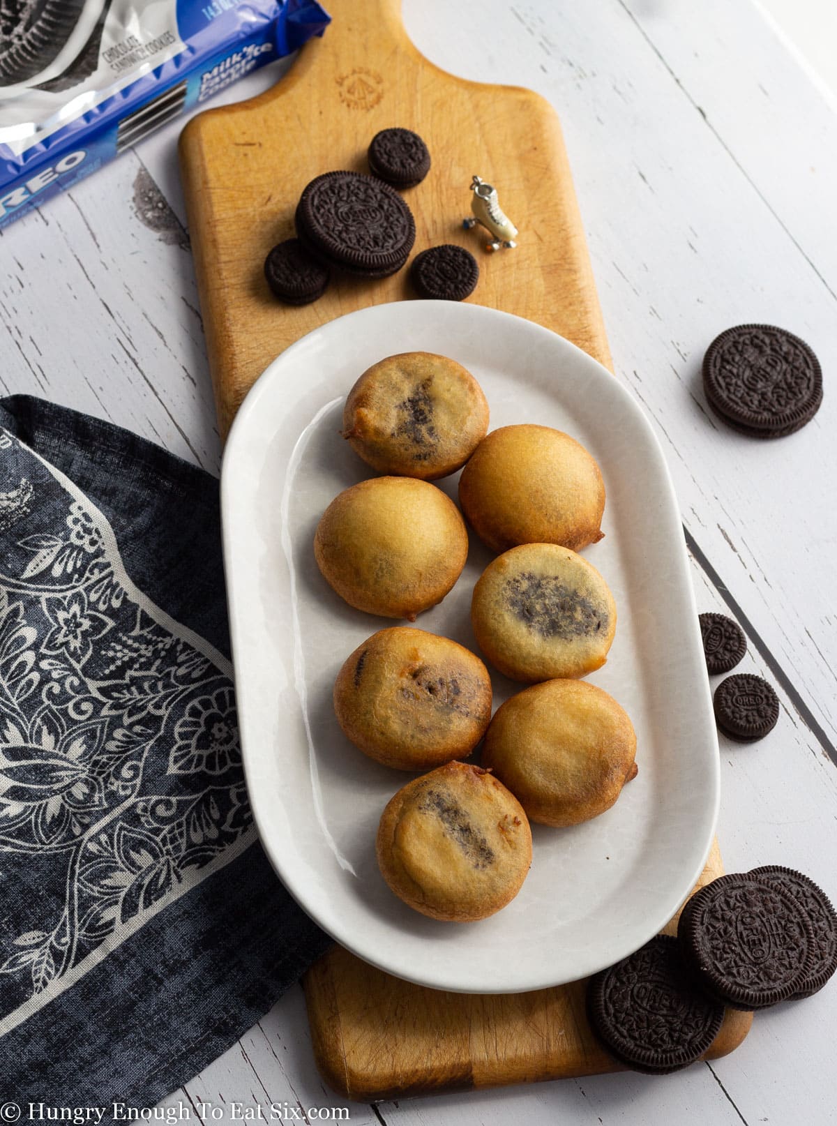 Whit oval plate with several fried Oreo cookies