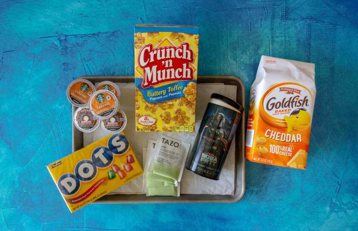 Dots candy, coffee pods, tea bags, Goldfish crackers, and caramel popcorn.