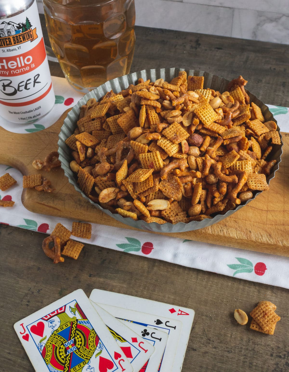 Snack mix near playing cards