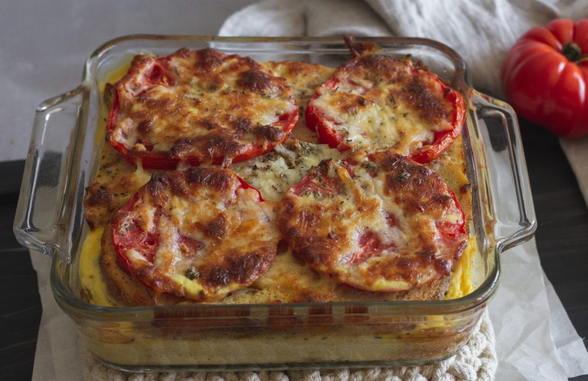 Browned cheese over tomatoes and egg bake