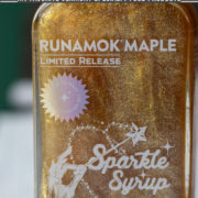Glass bottle of maple syrup