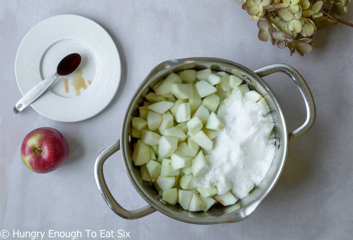 Pan with chopped apples and sugar.