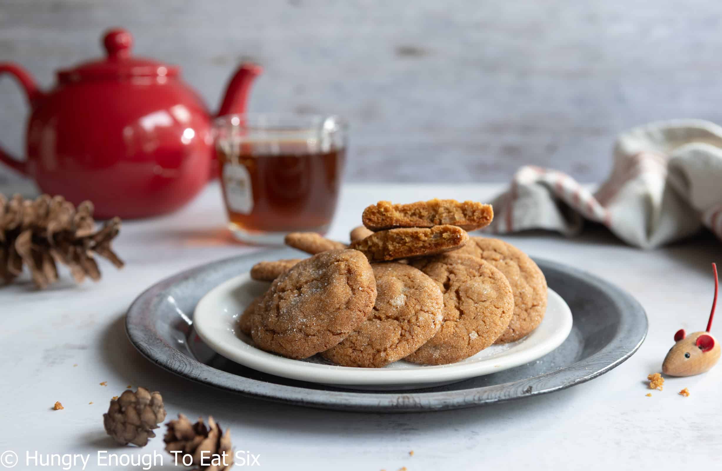 Plate of baked ginger cookies with a cup of tea.