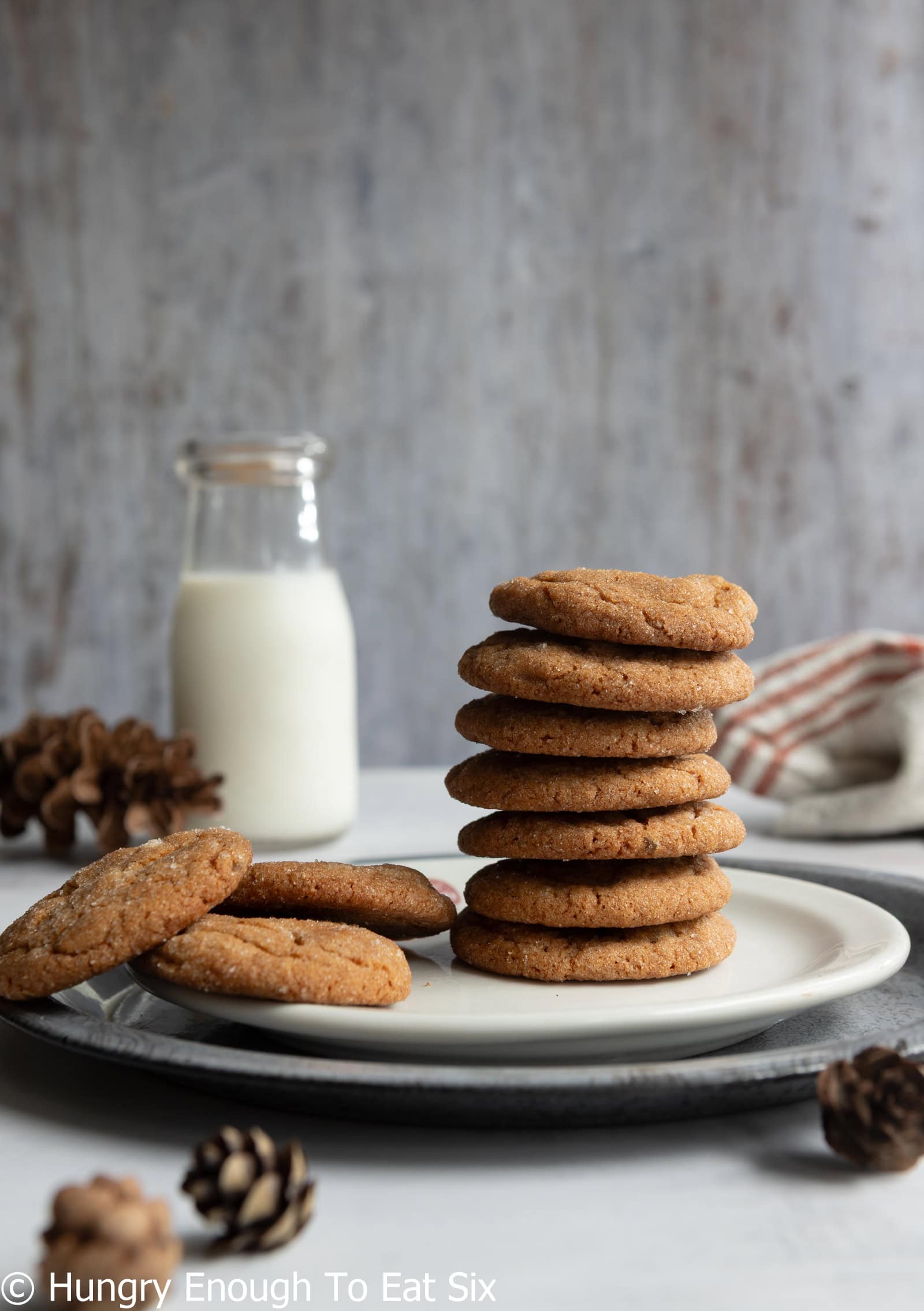 Ginger cookies piled and stacked on a plate.
